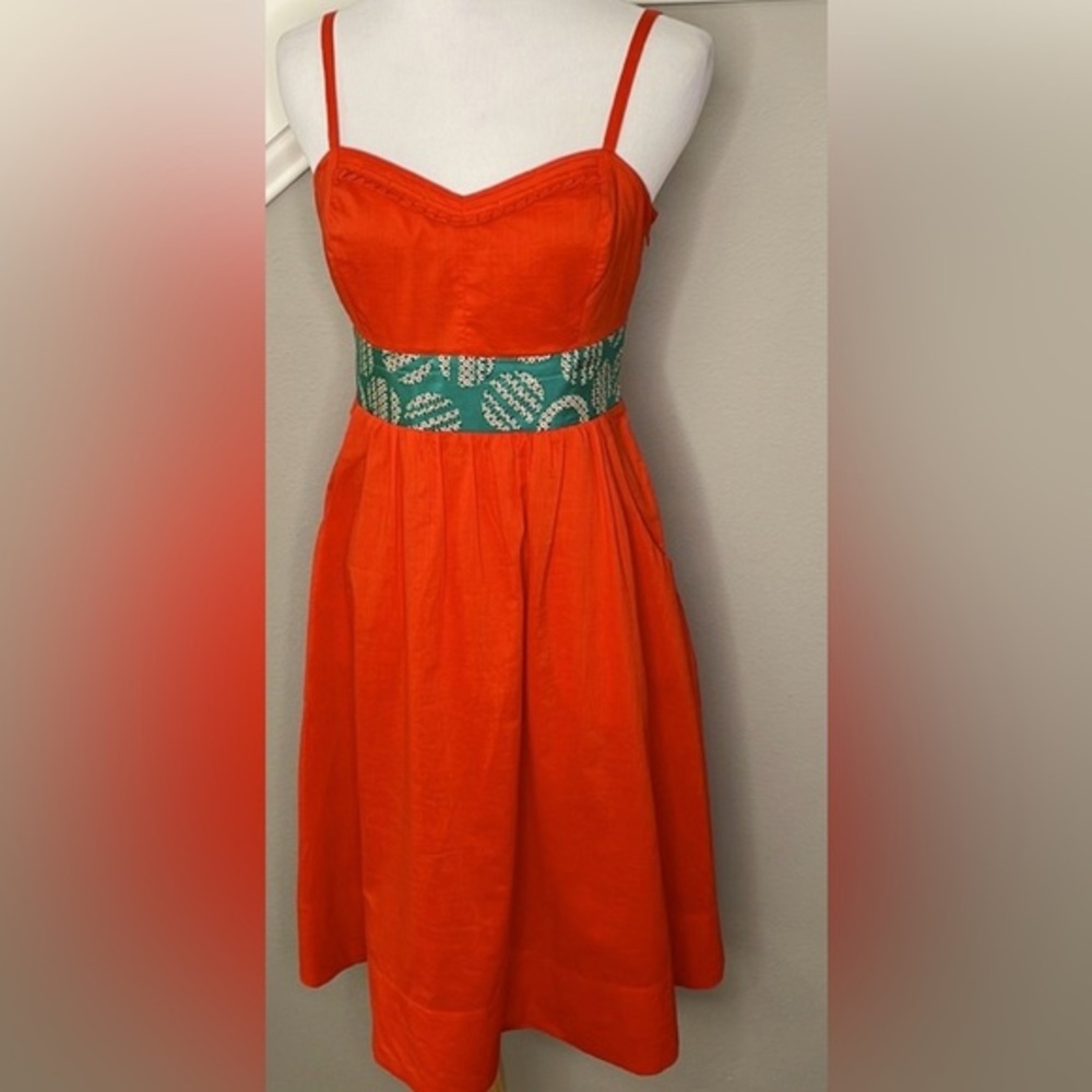 Elegant Strapless Orange Dress with Green Accent